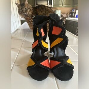Brand new sassy heels ! Great colors and unique design .